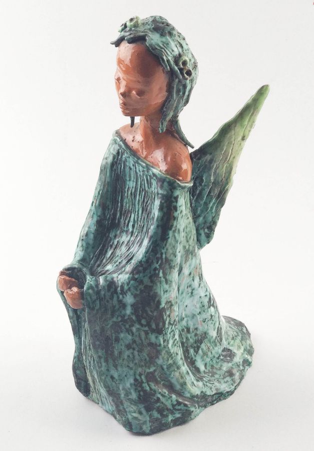 Figura feminina com asas